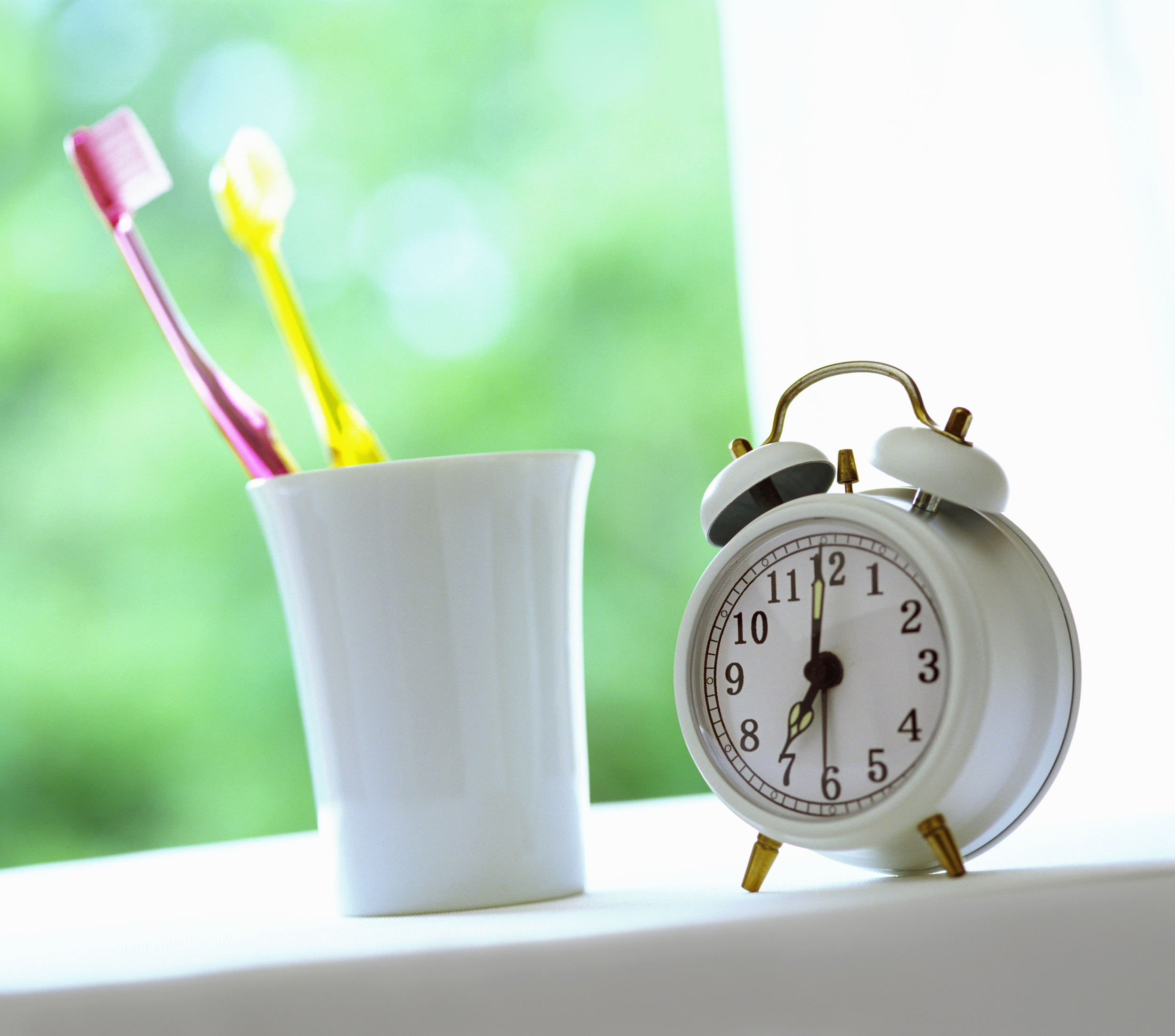 toothbrush and clock for office hours